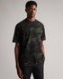 TUGO-Tops-Made from 100% cotton and in a relaxed fit, TUGO perfect for weekend lounging. This quirky camo tee features a relaxed fit, crew neck and short sleeves. Team with jeans and trainers for an easy weekend look.By choosing Ted Baker cotton products, you're supporting our investment in the Better Cotton Initiative's mission. This product is sourced via a system of mass balance and therefore may not contain Better Cotton. T-shirt 100% cotton Relaxed fit Camo jigsaw print Short sleeved Crew neck Grace is